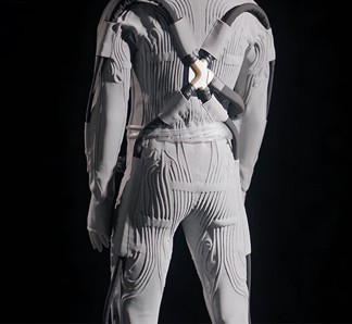 A grey, textured lunar suit with pronounced lines and straps, viewed from behind against a dark background.